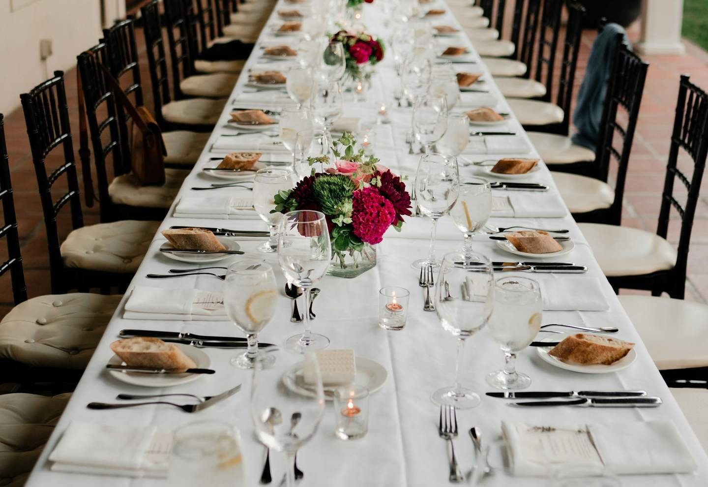 Long dining table prepared for a formal gathering
